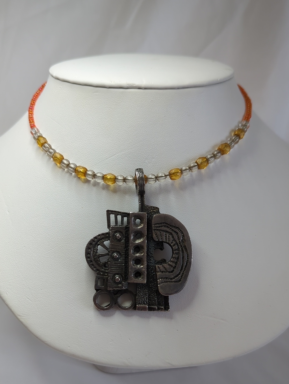 Handcrafted Black Metal Abstract Pendant Necklace with Amber Beads